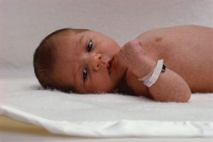newborn baby with hospital bracelet