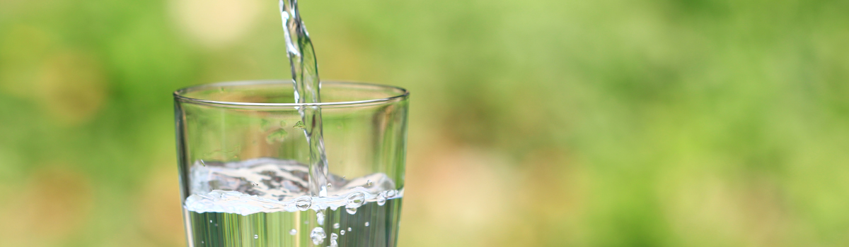 Water being poured into a drinking glass