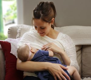 young woman breastfeeding her baby