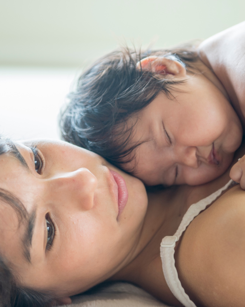 baby laying on mother's chest