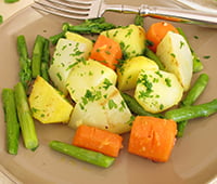 Vegetable pan with green asparagus, carrots, potatoes and german turnip